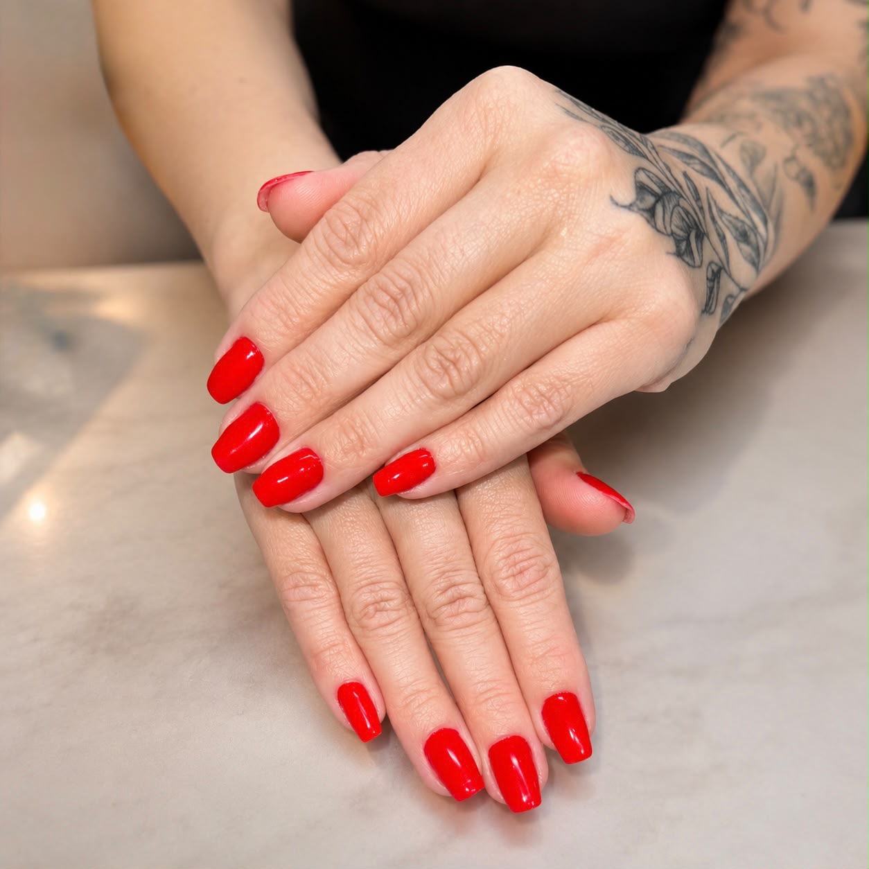 Glossy classic red gel manicure on square-shaped natural nails by STTUDIO BL